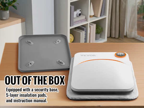 Máquina de prensado térmico VEVOR con base de seguridad, almohadillas aislantes de 5 capas y manual de instrucciones sobre una mesa.