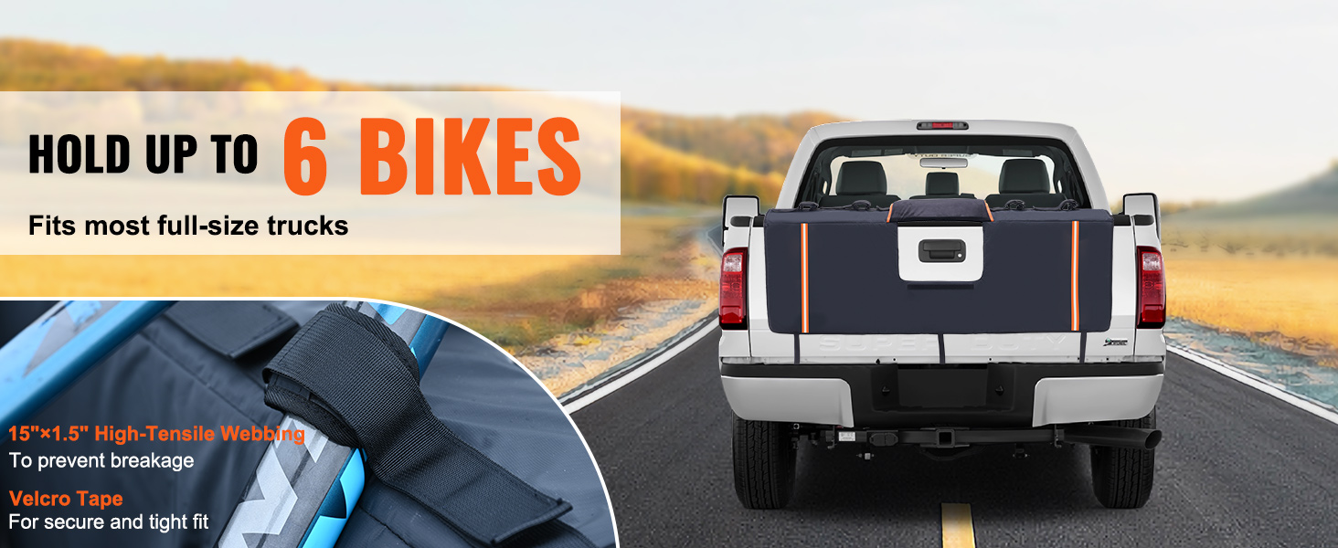 VEVOR tailgate pad holding up to six bikes in a full-size truck on a rural road. features high-tensile webbing.
